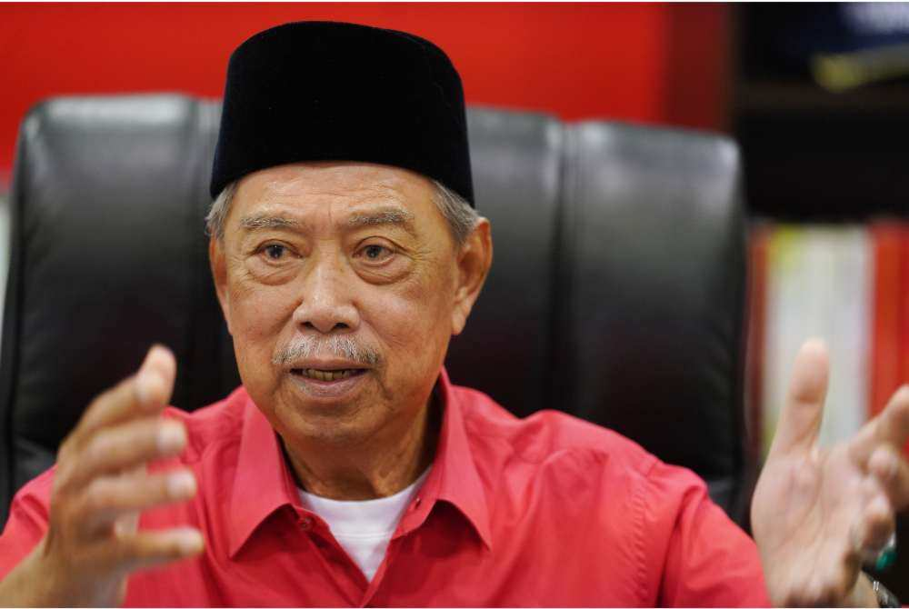 ‘I didn’t want to sit there,’ says Muhyiddin on sitting beside Hamzah