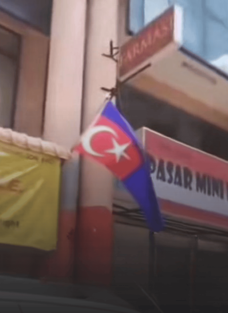 johor flag hung upside down at a mini market august 2025